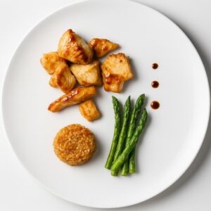 Teriyaki chicken with Mexican rice and asparagus